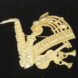 AJC Musical Gold Tone Statement Brooch Sax Trumpet Guitar Keyboard Signed Vtg